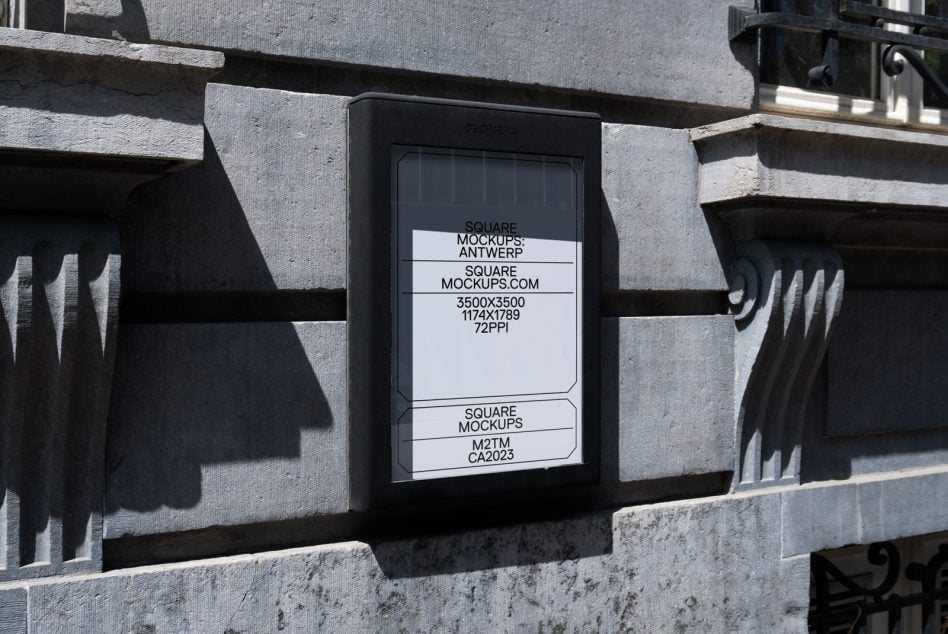 Stone building facade with mounted light box displaying simple white mockup design
